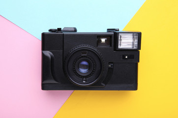 Vintage camera on colorful background. Old photo camera on background