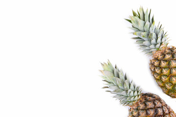 Obraz premium Two pineapples isolated on white background, close up