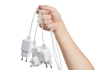 Fototapeta na wymiar Hand holding white plugs, isolated on white background