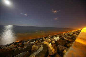 Night sea pano with moon and part of boardwalk 