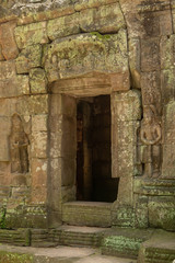 Fototapeta na wymiar Decorated doorway and bas-reliefs at ruined temple