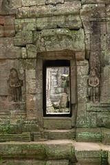 Fototapeta na wymiar Decorated entrance and bas-reliefs at Ta Som