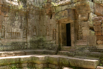 Doorway in temple wall decorated with figures