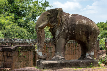 Fototapeta na wymiar Elephant statue at corner of ruined temple