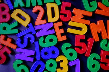 Fototapeta premium Colorful magnetic numbers and letters on the fridge