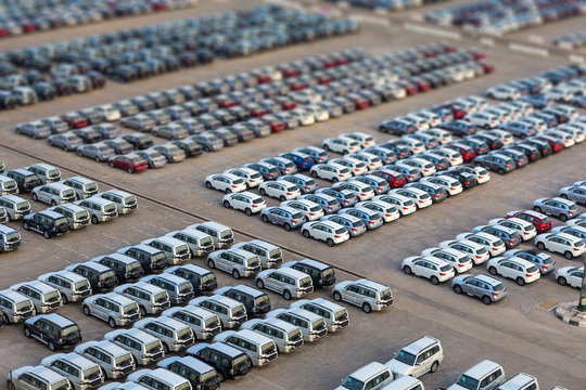 Dubai, UAE - January 03, 2017:  New cars in rows stored at port Rashid in Dubai, UAE