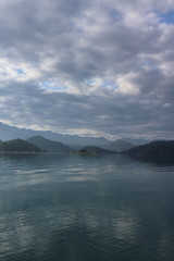 Beautiful landscape view of mountain and lake with reflection in the morning under sky and cloud, Nantou, Taiwan