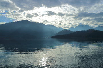 Beautiful landscape view of mountain and lake with reflection in the morning under sky and cloud, Nantou, Taiwan