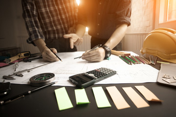 Concept Agreement between the employer and architect Nick and desk of Architectural project in construction site or office building with morning light