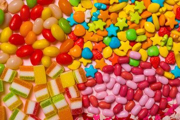 Fototapeta na wymiar Candy, sweets, marshmallow on a bright background. Candy pattern