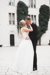 Naklejka premium Sensual portrait of a young wedding couple. Outdoor