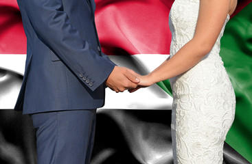 Husband and Wife holding hands - Conceptual photograph of marriage in Sudan