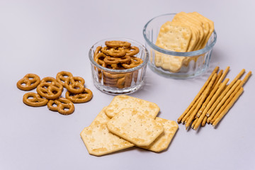 Salty Crackers Sticks Pretzels Top View Above Blue Background Party Snacks Mix Variety of Tasty Crackers for Beer