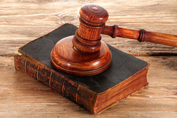 Law gavel or judge mallet on a wooden desk