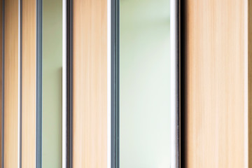 Mirror Sliding Doors Wardrobe Closeup. Home or Office Furniture, Interior Abstract Design Concept.