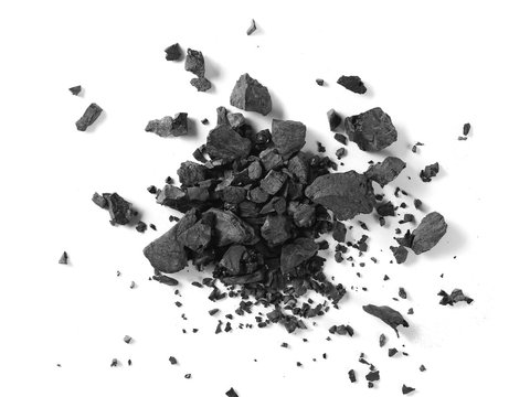 Black coal pile isolated on white background, top view