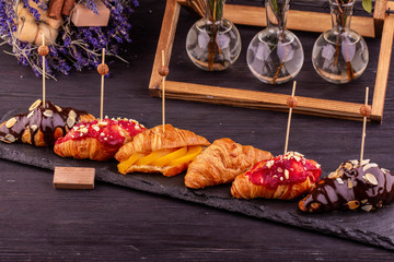  Croissants sweet with nuts and chocolate, raspberry and fruit