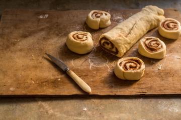 buns  with cinnamon - Cinnabon cooking process. (food background). copy space