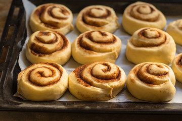 Obraz na płótnie Canvas buns with cinnamon - Cinnabon cooking process. (food background). copy space