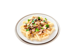 Spiral pasta with spring morel mushrooms on a plate isolated on white background with clipping path
