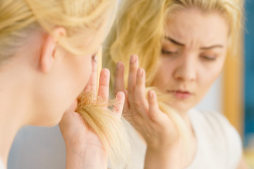 Woman having blonde split ends hair