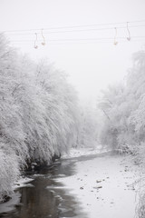 concept of empty mountain resort with cable railway covered with deep snow