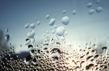 Sunset in drops on glass