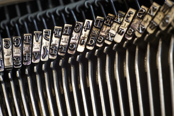 Close-up letters of retro typewriter machine.