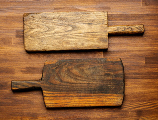 empty old cutting boards on wooden background , top view. Flat lay background.