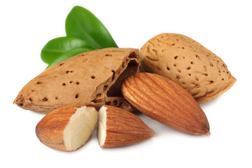 almond with green leaves isolated on white background