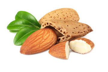 almond with green leaves isolated on white background