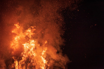 Fototapeta na wymiar Ancient tradition of Epiphany fires in Friuli. Pignarûl and fireworks.