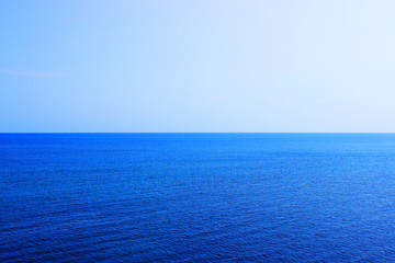 Calm Sea and Blue Sky Background.