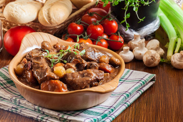 Beef Bourguignon stew served with baguette