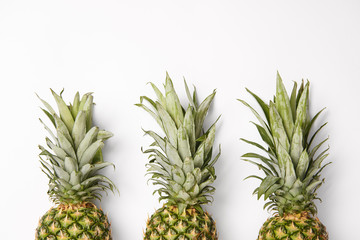 fresh, organic and tasty pineapples on white  background