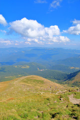 Ascent along a steep path to the top of the mountain in the picturesque Carpathian mountains.