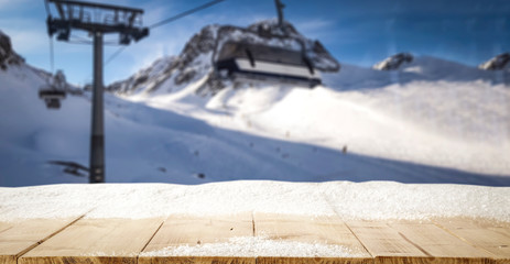 Fototapeta premium Desk with snow and frost with Alps mountains landscape 