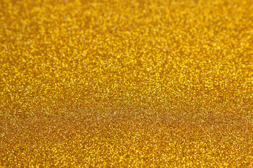 Beautiful texture of yellow sparkles. glitter background. shiny texture