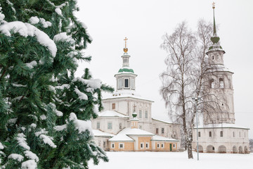 Russian Orthodox Church and Christmas tree in the winter among white snow. Veliky Ustyug, Russia