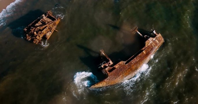 shipwreck aerial footage with a 90 degree angle. Cemetery of ships. Luanda. Angola.