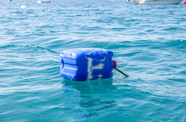 Blue drum floating in the sea