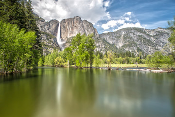 Fototapeta na wymiar Yosemite Falls in Yosemite National Park with Reflection on the River