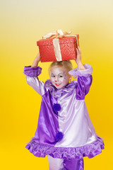 Harlequin clown with present