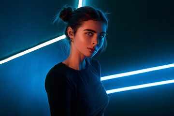 Portrait of a girl in the studio with neon light
