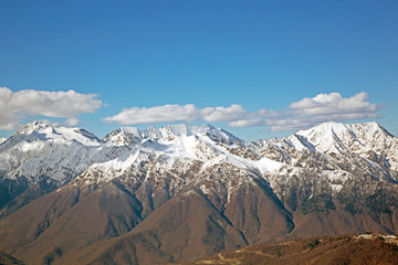 snowy mountain peaks against the blue sky