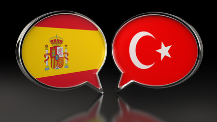 Spain and Turkey flags with Speech Bubbles. 3D illustration