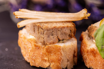 A liver duck on bruschetta with fresh pear