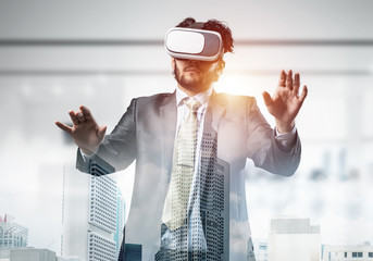 Handsome elegant businessman experiencing impressive virtual rea