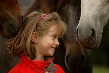 Little girl with foals