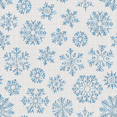 Seamless embroidery snowflakes background.